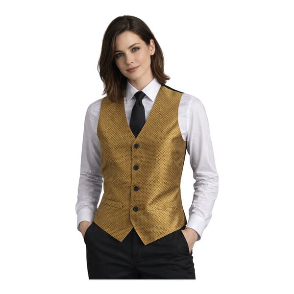 A women's gold brocade diamond pattern server vest with black buttons, worn over a white shirt and black tie.