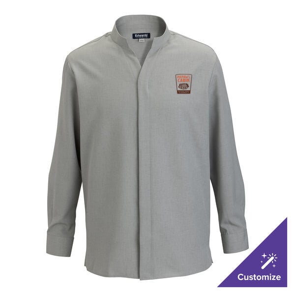 A men's platinum long sleeve dress shirt with a stand-up collar and a small embroidered patch on the chest.