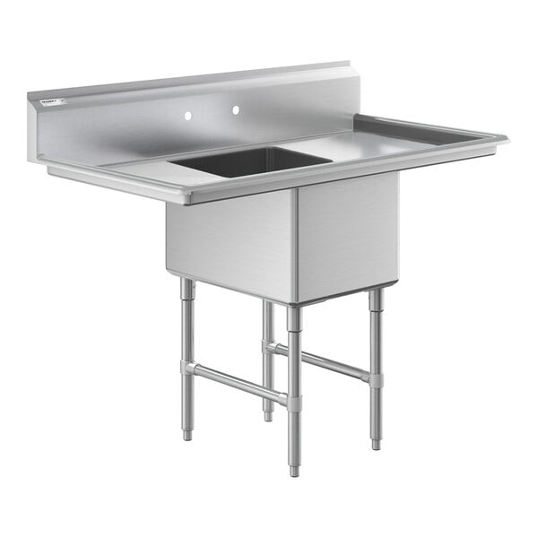 A stainless steel commercial sink with one deep basin, two side drainboards, and sturdy legs with cross bracing.