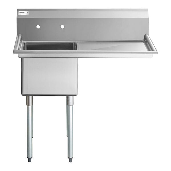 A stainless steel commercial sink with one deep basin, a right-side drainboard, and four metal legs.
