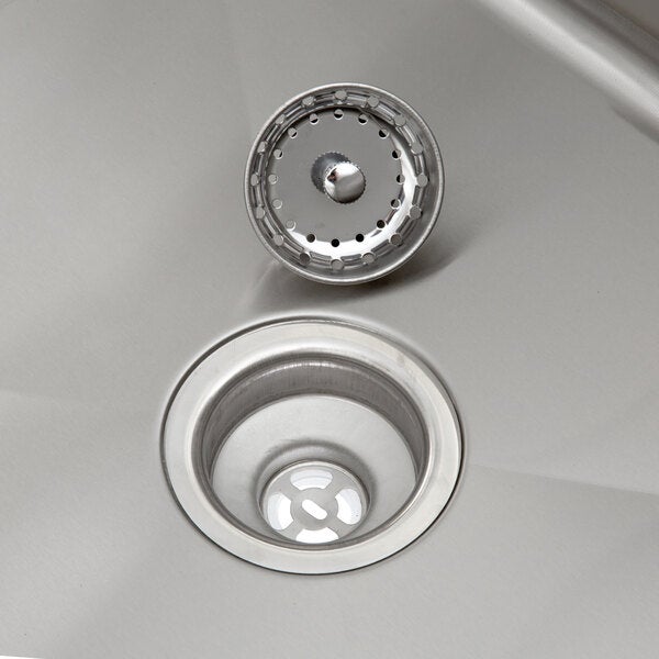 A stainless steel sink drain with a removable strainer basket.