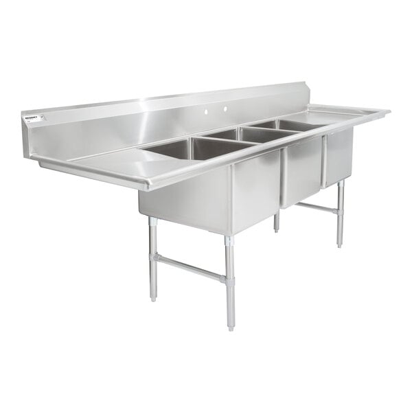 A large stainless steel three-compartment sink with two side drainboards, supported by metal legs and cross bracing.