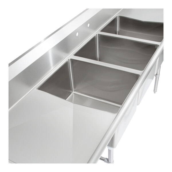 A stainless steel three-compartment sink with two drainboards and sturdy legs.