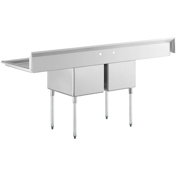 A large stainless steel commercial sink with two compartments, two drainboards, and galvanized steel legs.