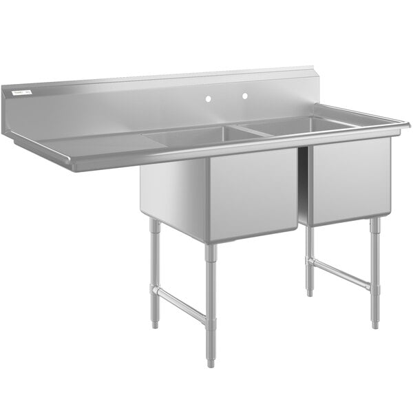 A stainless steel two-compartment commercial sink with a left-side drainboard, stainless steel legs, and cross bracing.