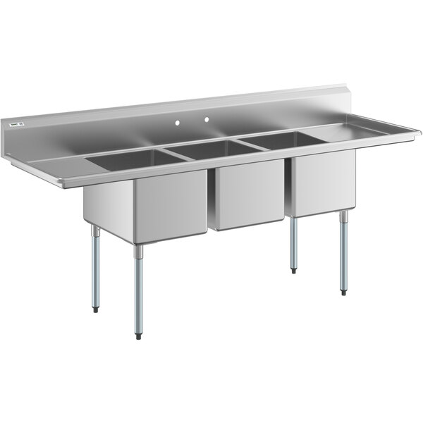 A large stainless steel three compartment commercial sink with two drainboards and galvanized steel legs.