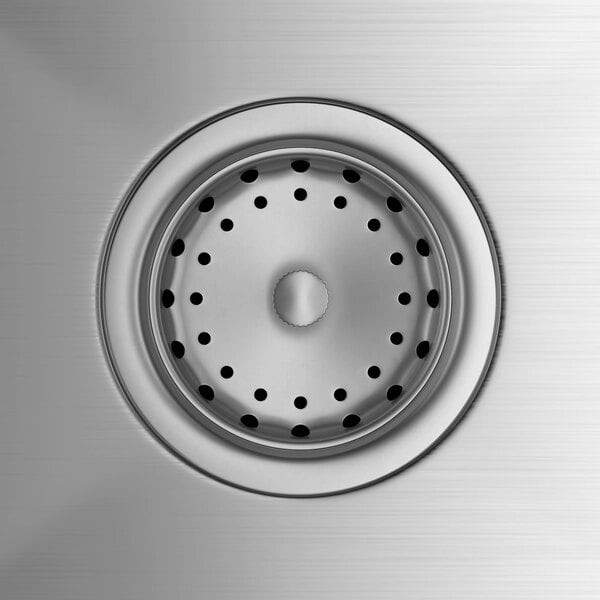 A stainless steel commercial sink drain with a perforated strainer basket.
