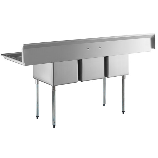 A large stainless steel three-compartment commercial sink with two drainboards and galvanized steel legs.