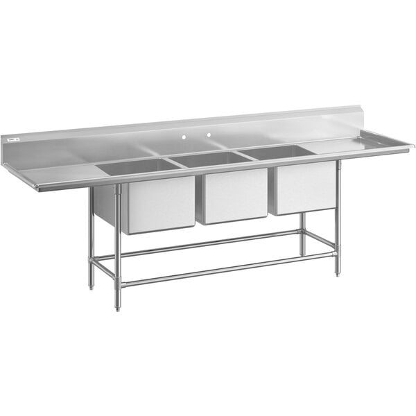 A large stainless steel three-compartment commercial sink with two drainboards, stainless steel legs, and cross bracing.