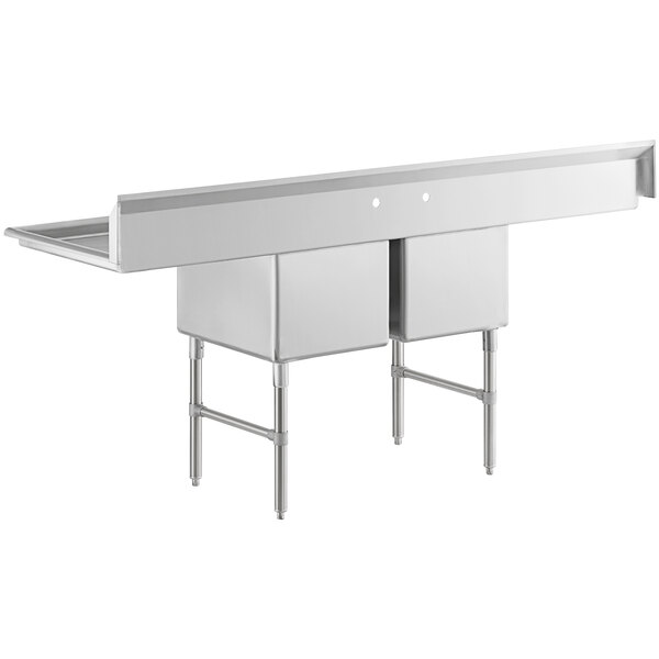A large stainless steel commercial sink with two compartments, two drainboards, stainless steel legs, and cross bracing.
