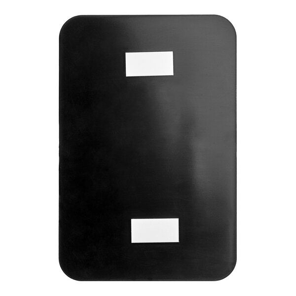 A rectangular black and white plastic 'Exit' sign with braille.