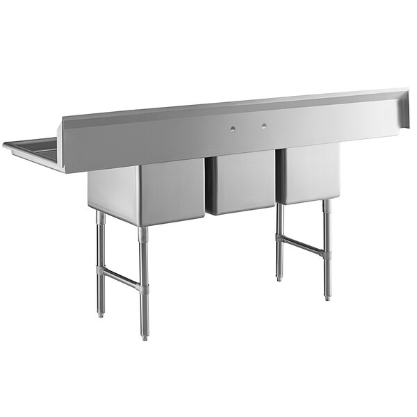 A large stainless steel three-compartment commercial sink with two drainboards, stainless steel legs, and cross bracing.