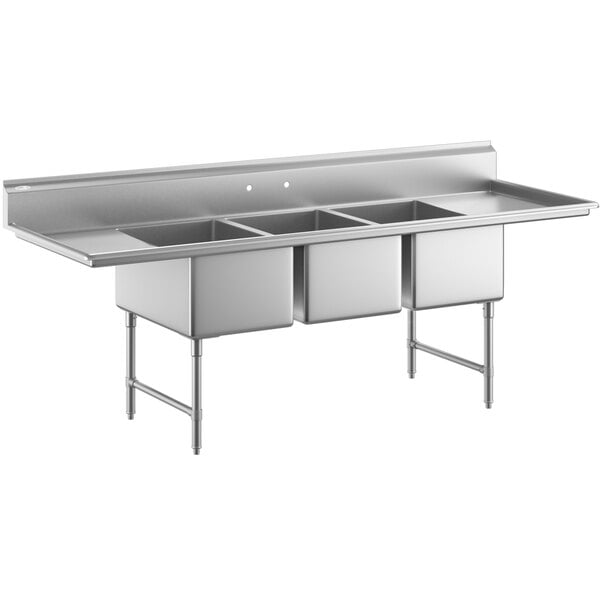 A large stainless steel three-compartment commercial sink with two drainboards, stainless steel legs, and cross bracing.