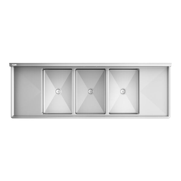 A top-down view of a large stainless steel sink with three rectangular basins and two drainboards on either side.