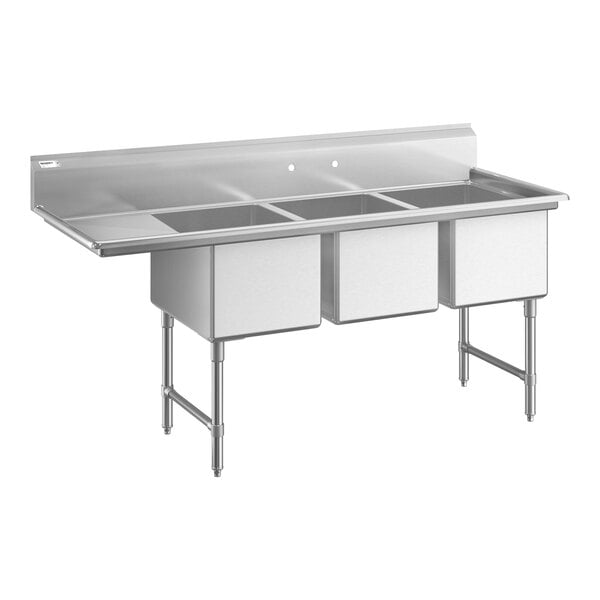 A large stainless steel three-compartment sink with an attached left-side drainboard and sturdy legs with cross bracing.