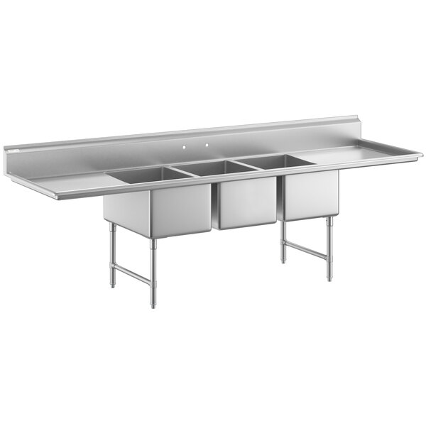 A large stainless steel three-compartment commercial sink with two drainboards, stainless steel legs, and cross bracing.