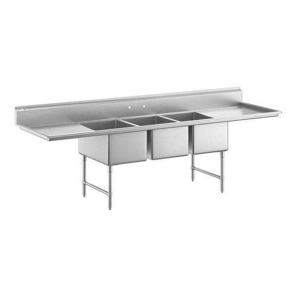 A large stainless steel sink with three deep compartments, two side drainboards, and sturdy metal legs with cross bracing.