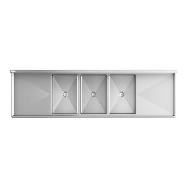 A top-down view of a large stainless steel sink with three rectangular basins and two drainboards on either side.