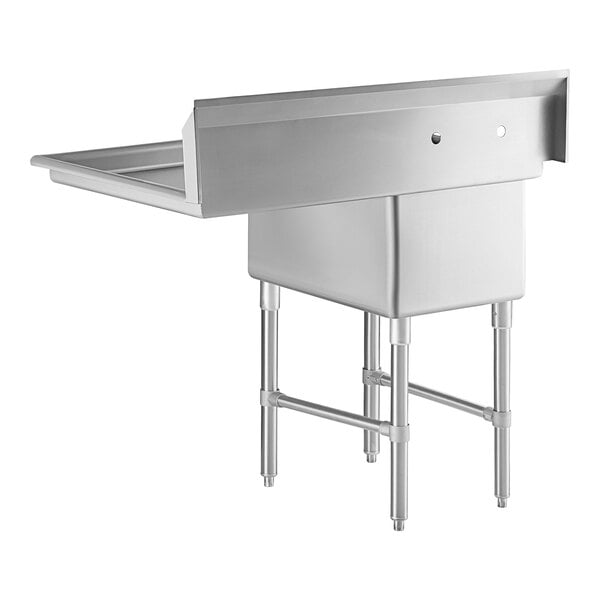 A stainless steel commercial sink with four legs, a single deep basin, a high backsplash, and a right-side drainboard.