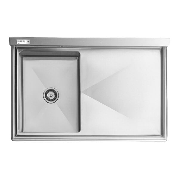 A rectangular stainless steel sink with a single square basin on the left and a large flat drainboard on the right.
