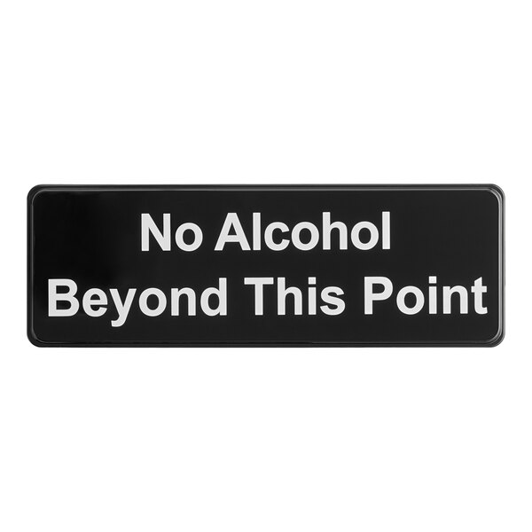 A rectangular black and white sign that reads 'No Alcohol Beyond This Point.'