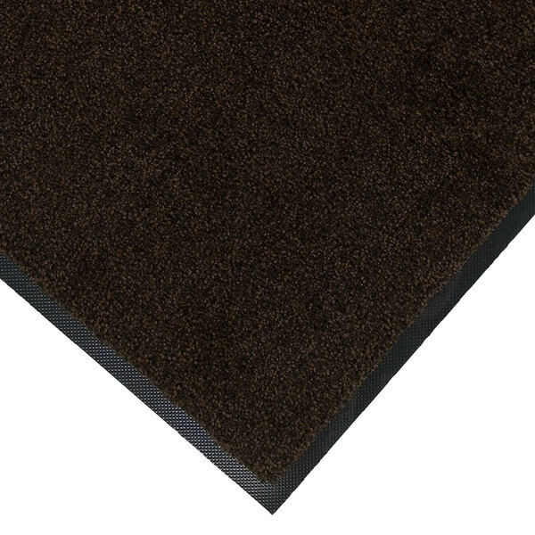 A brown and black rectangular floor mat with a plush texture and universal cleated backing.