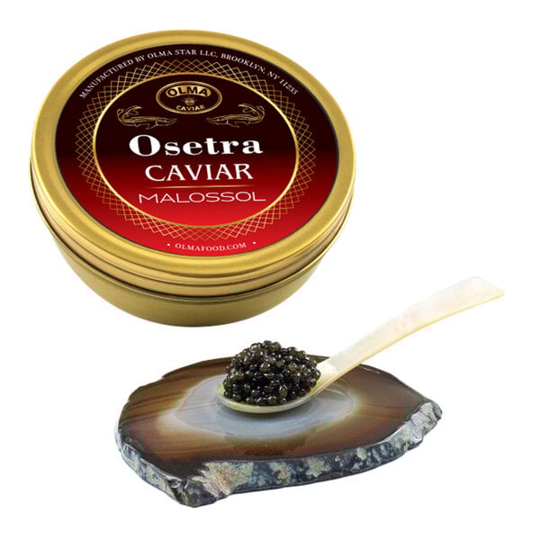 A tin of OLMA Russian Osetra caviar with a spoonful of caviar on a decorative stone plate.