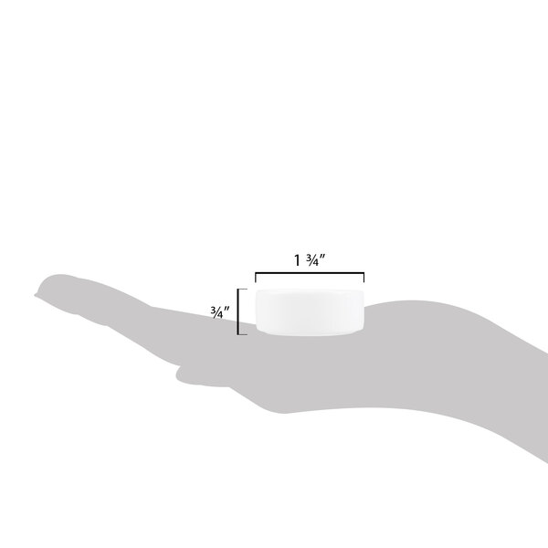 A small, round, white porcelain salt and pepper dish measuring 1 3/4 inches in diameter and 3/4 inch in height.