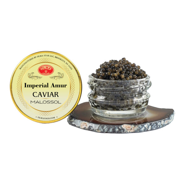A 28-gram jar of OLMA Imperial Amur Caviar with its lid displayed beside it.