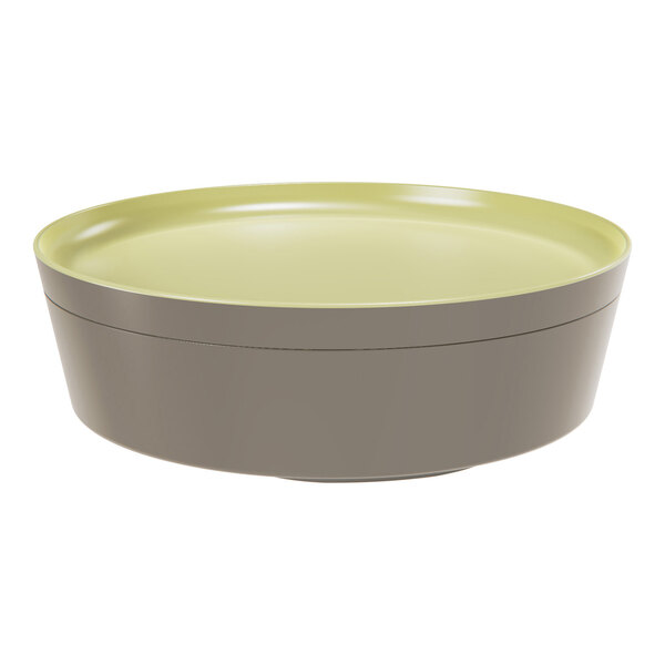 A round green melamine plate that also functions as a lid for a bento box.