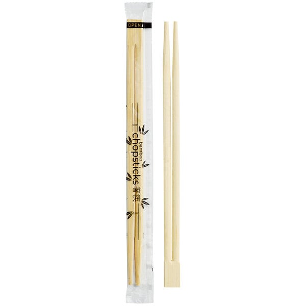 A pair of disposable bamboo chopsticks with one pair shown in a clear wrapper and another pair unwrapped.