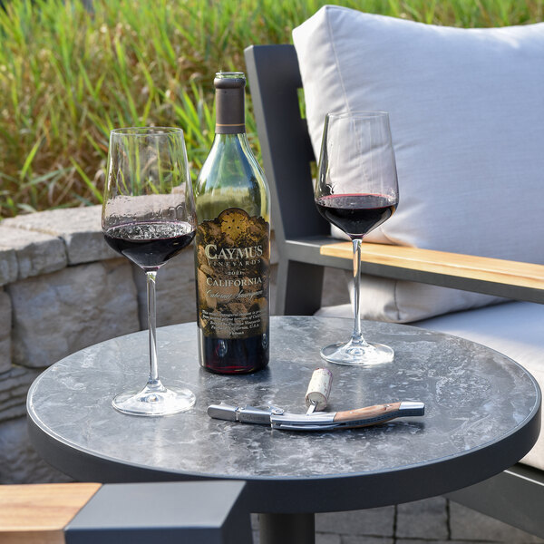 Outdoor Interiors Portofino Orobico 20" Round Sintered Stone and Aluminum End Table