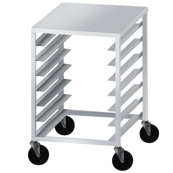 An Advance Tabco aluminum dough box rack with black wheels on the bottom.