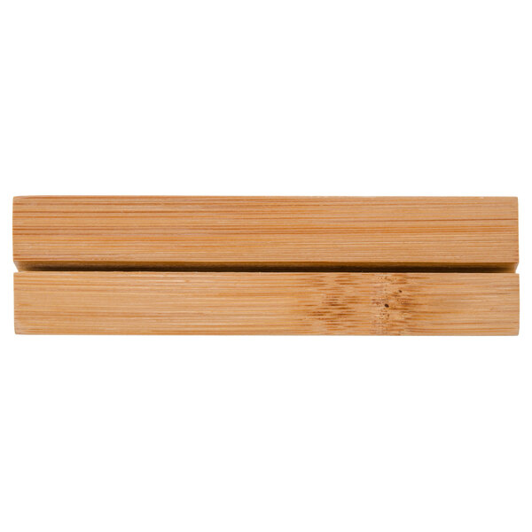 A 4-inch natural bamboo card holder with a horizontal slot for holding cards.