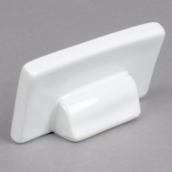 A rectangular white ceramic card sign holder.