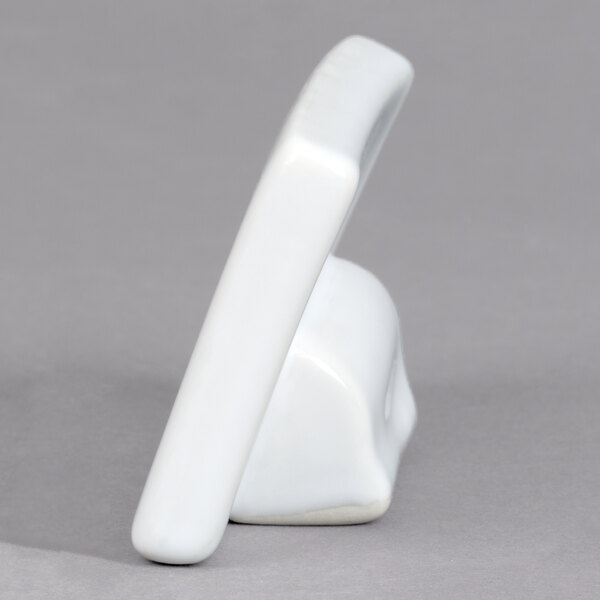 A small rectangular white ceramic card sign holder.