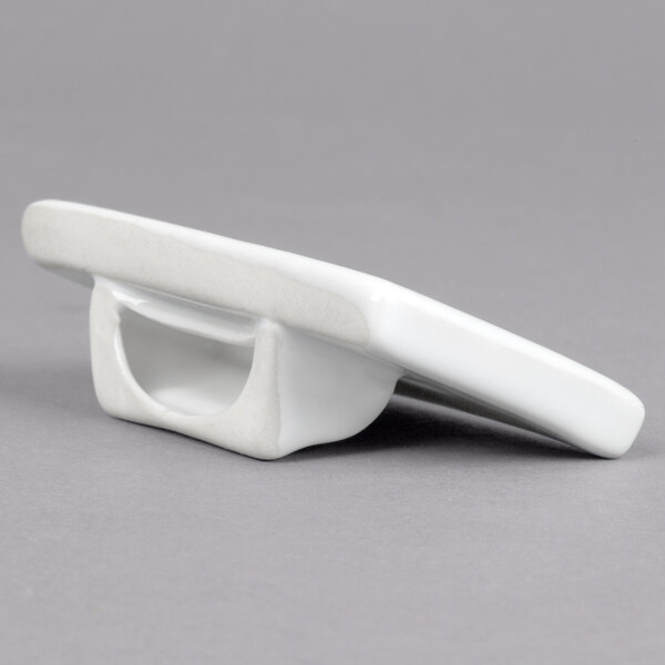 A rectangular white ceramic card sign holder with a slanted design.