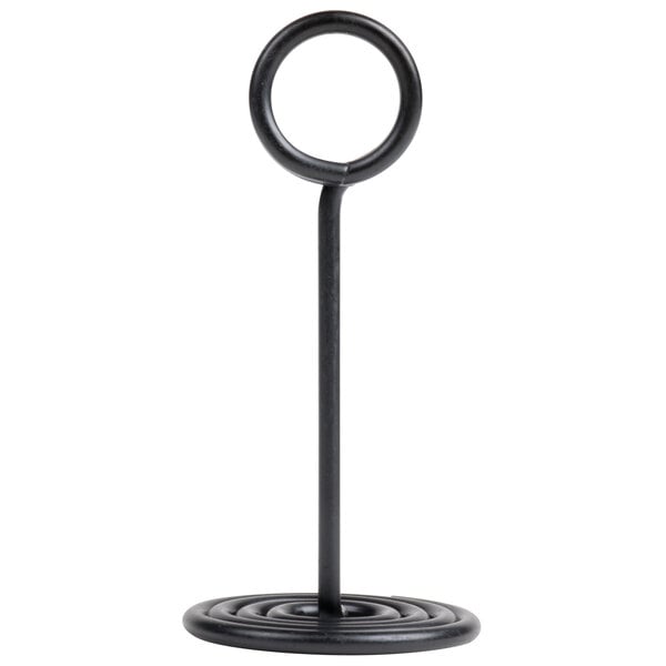 A black metal card holder with a swirl base and circular top.