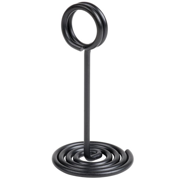 A black metal card holder with a swirl base and circular top.