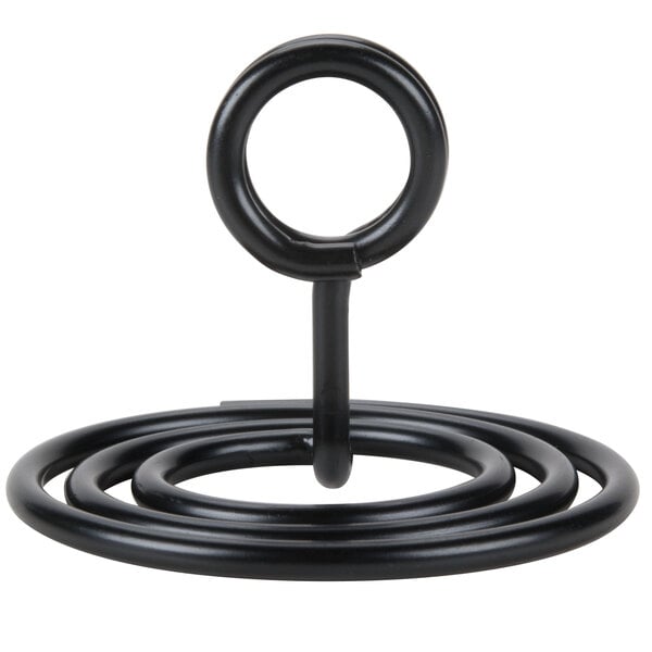 A black metal swirl base card holder with a circular top for displaying cards.