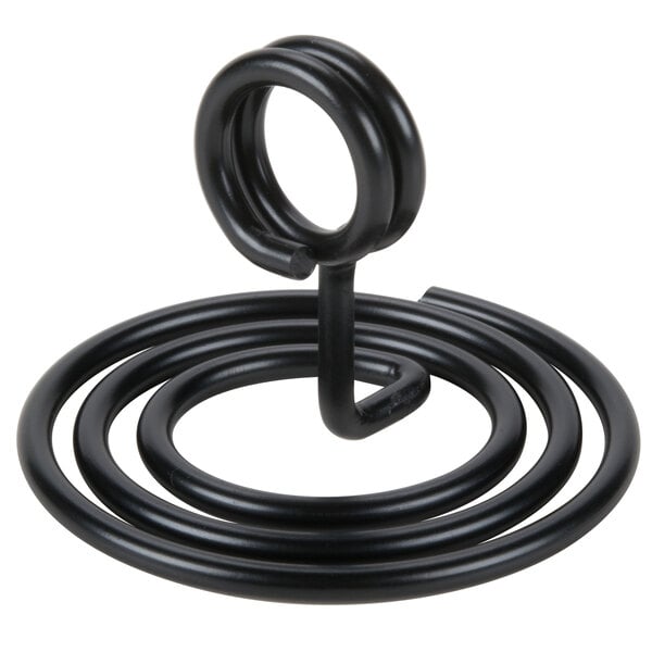 A black metal swirl base card holder with a circular design and upright loop for holding cards.