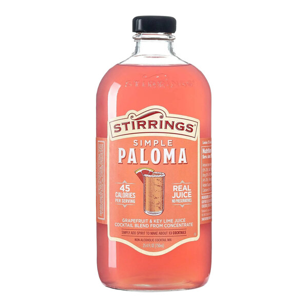 A 750 mL bottle of Stirrings Simple Paloma grapefruit and key lime juice cocktail mix.