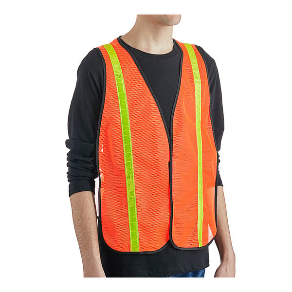 An orange high visibility safety vest with yellow reflective stripes and a hook and loop closure.