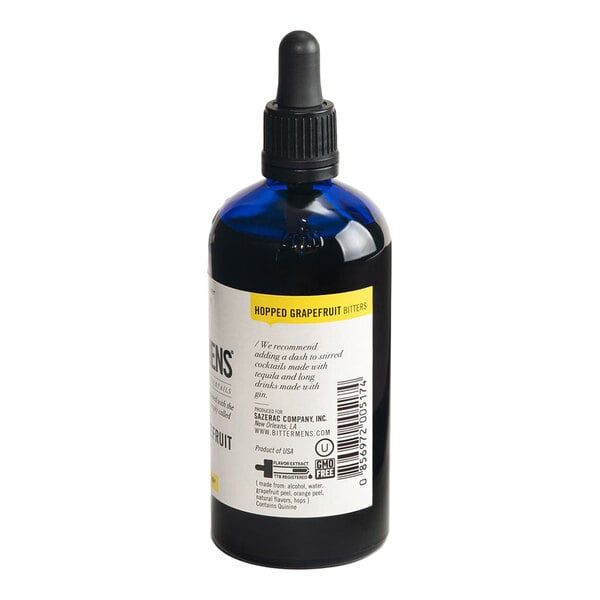 A 5 fl. oz. bottle of Bittermens Hopped Grapefruit Bitters with a dropper cap.