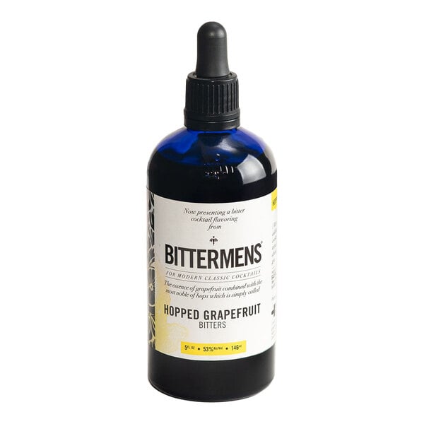 A 5 fl. oz. bottle of Bittermens Hopped Grapefruit Bitters with a dropper cap.