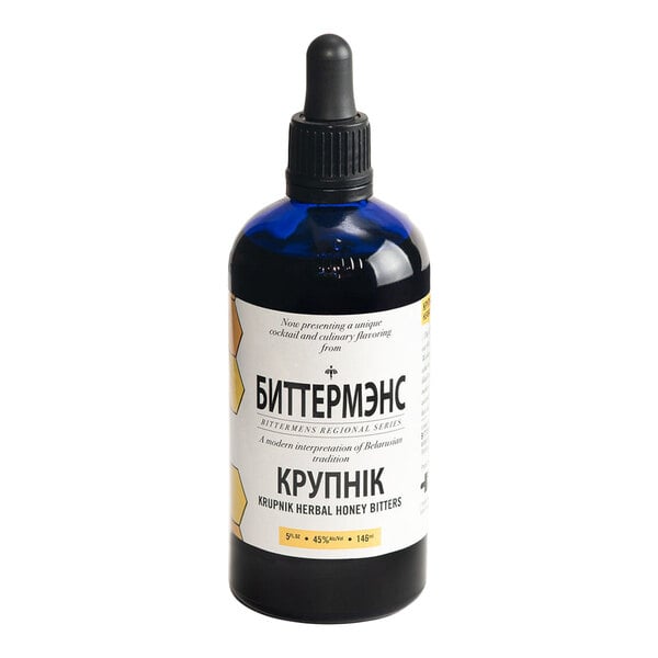 A 5 fl. oz. bottle of Bittermens Krupnik Herbal Honey Bitters with a dropper cap.