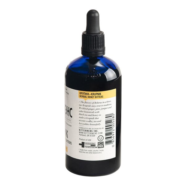 A 5 fl. oz. bottle of Bittermens Krupnik Herbal Honey Bitters with a dropper cap.