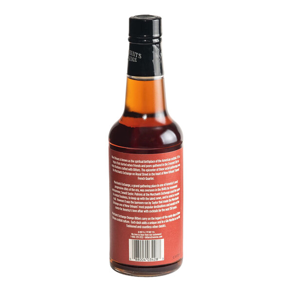 A 10 fl. oz. bottle of Merchants Exchange Orange Bitters with a black cap and red label.