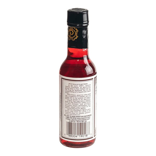A 5 fl. oz. bottle of Peychaud's Aromatic Cocktail Bitters.