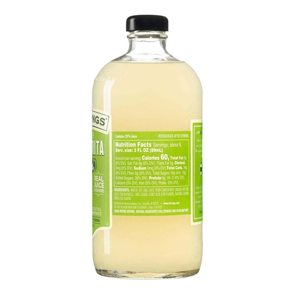 A clear glass bottle of Stirrings Margarita Mix with a black cap and green label, containing 750 mL of liquid.